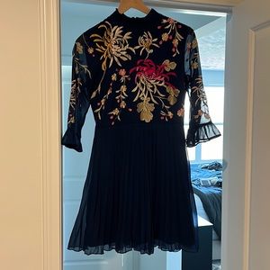 ASOS DESIGN embroidered pleated midi dress with fluted sleeve in navy